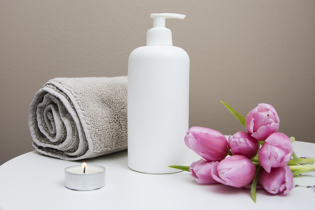 Woman enjoying a mindful wellness routine with skincare products